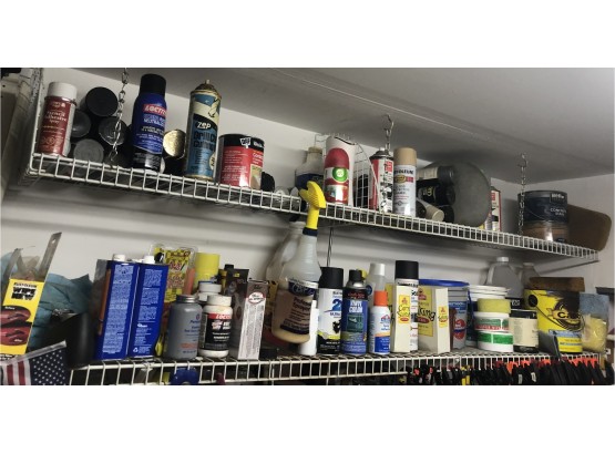Two Shelves Of Assorted Paints And Products