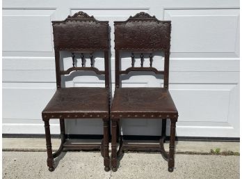 A PAIR OF ANTIQUE TOOLED  LEATHER SIDE CHAIRS