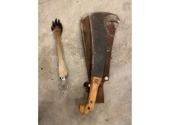 A KANGAROO PAW BOTTLE OPENER AND MACHETE 17' AND SMALLER