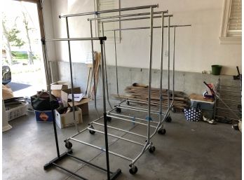 4 Identical Rolling Clothes Racks And 1 Stationary Rack. Disassembly Required