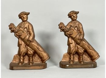 A PAIR OF VINTAGE CAST IRON GOLF CADDY BOOKENDS/DOORSTOPS
