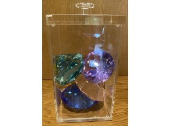 Faceted Colored Glass In Lucite Container