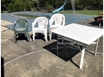 White Outdoor Tables And 12 Plastic Chairs