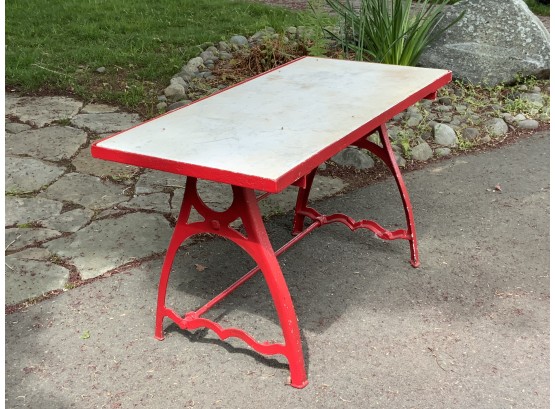 Red Metal Base With A Rectangular Marble Top