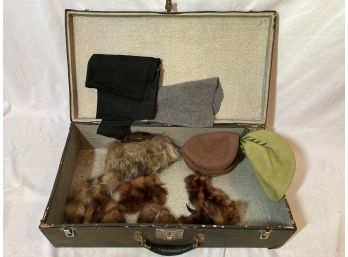 Old Suitcase Filled With A Few Furs And Felt Pieces