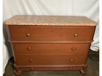 Four Drawer Dresser With Coral Colored Marble Top
