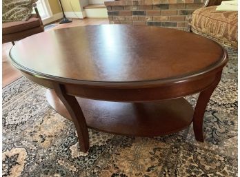 Oval Wooden Coffee Table With Bottom Shelf Area