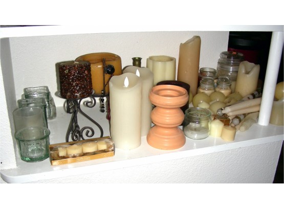 Shelf Of Candles And Candle Holders