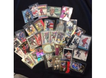 Lot Of Assorted Hockey Cards In Top Loaders