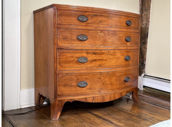 An Antique English Bow Front Yew Wood Veneer Chest Of Drawers
