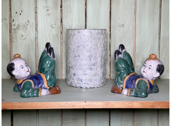 A Pair Of Ceramic Bookends And Candle Decor