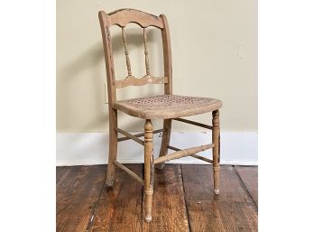 An Antique Spindle Back Cane Seated Side Chair