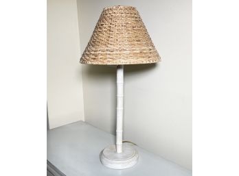 A Bamboo And Wicker Stick Lamp