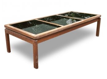 A Danish Modern Teak Coffee Table With Smoked Glass Paneled Top