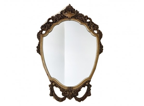 A Shield Form Mirror In Gilt Wood Frame