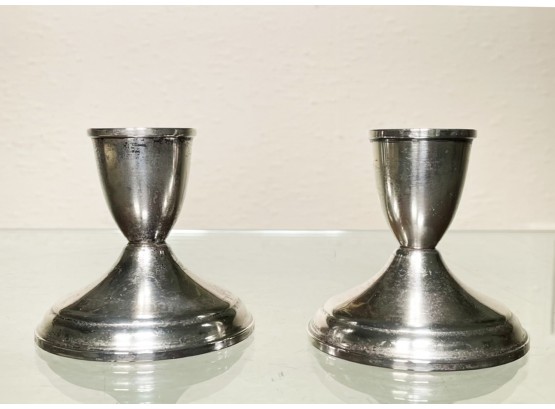 A Pair Of Weighted Sterling Candlesticks