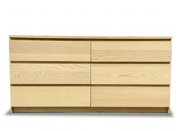 A Modern Dresser In Blonde Oak Veneer