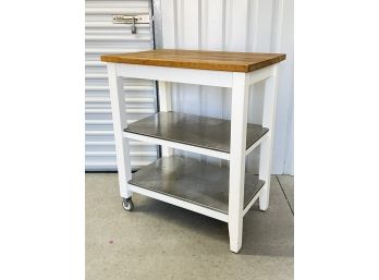 A Kitchen Island Or Prep Cart With Stainless Shelves And Hardwood Top