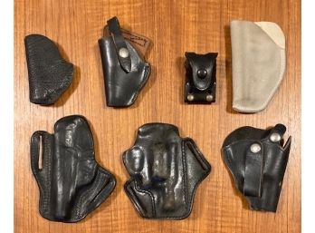 Lot Of Six Vintage Leather Gun Holsters And A Speed Loader Case Most For .38 Caliber Hand Guns.