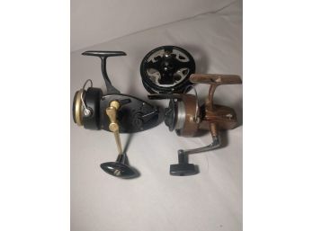 Classic Fishing Set Of Two Spinning Reels And  Fly Fishing Reel