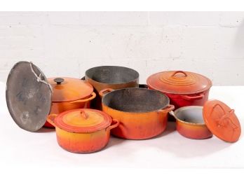 Collection Of Orange Enameled Cast Iron Cookware