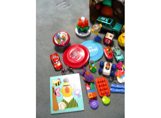 Toys, Balls, Musical Instruments, And A Puzzle