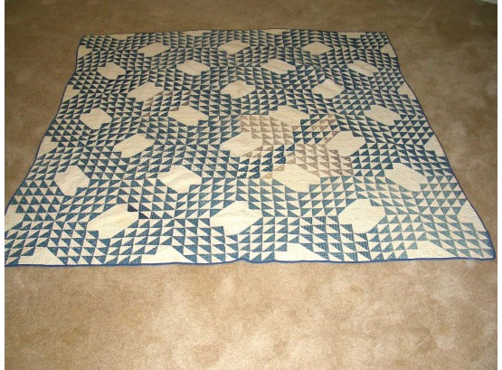 Quilt With Blue And White Triangle Designs