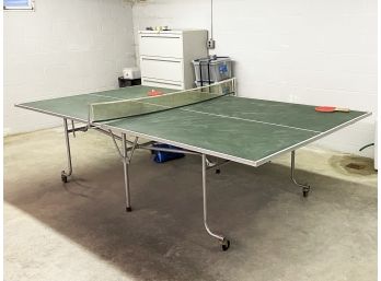 A Ping Pong Table And Accessories