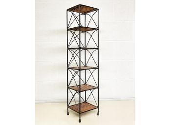 A Wrought Iron And Bamboo Etagere