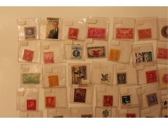 84 Assorted Stamps In Plastic Cases