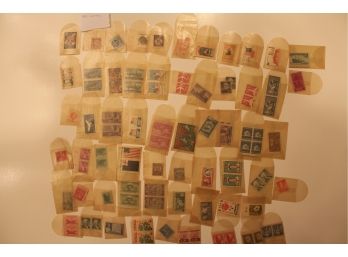 89 Unused Stamps In Sleeves