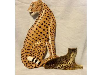 Fastest Land Animal The Cheetah. Sitting One Is Made Of Wood The Lying Down One Is Glass