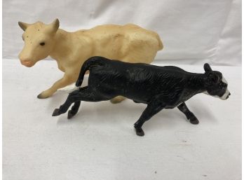 Two Cow Figurines