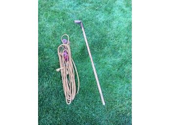 Rope With Block And Tackle And Garden Tool