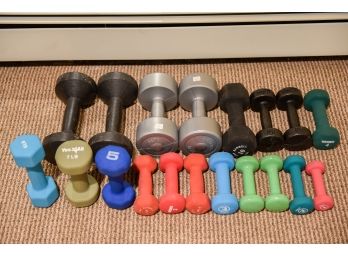 Collection Of Assorted Hand Weights In Various Weight Sizes