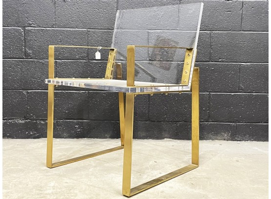 A Modern Brass And Lucite Campaign Chair