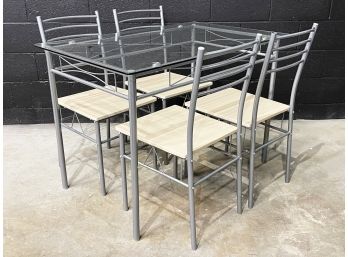 A Modern Glass Top Dining Table And Set Of 4 Chairs