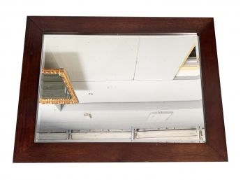 A Large Beveled Mirror In Mahogany Frame