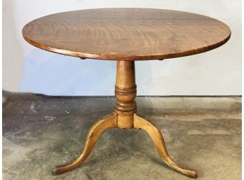 An Antique Tilt Top Table