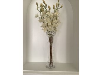 Tall And Slender Floral Arrangement In 19.5 Inch Glass Vase.