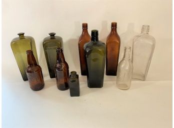 Group Of Antique Bottles Of Different Sizes And Colors