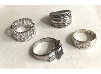 FOUR SILVER ONE FASHION RINGS