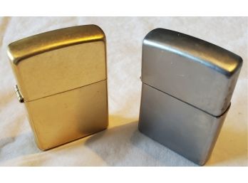 Two ZIPPO Cigarette Lighters - One Brand New (brass) And Other Has Minor Wear (silver-tone Metal)