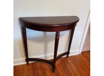 Stately Demi- Lune Accent Table With Three Turned Legs With Bun Feet