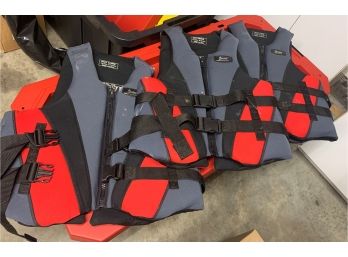Three Stearns Authentic Water Gear Life Jackets