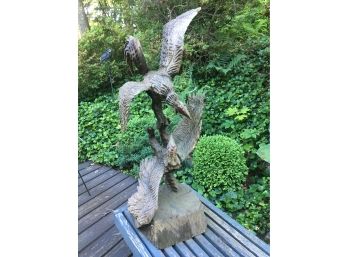 Wooden Outdoor Sculpture Of 2 Turkey Vulture At A Fight.