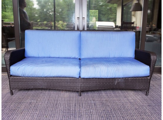 A Modern Woven Acrylic Outdoor Sofa With Sunbrella Cushions