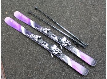 A Pair Of Rossignol Affinity Skis And Poles