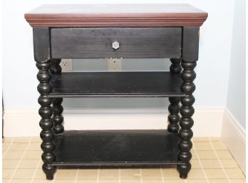 A Solid Wood Spool Style Nightstand Or End Table