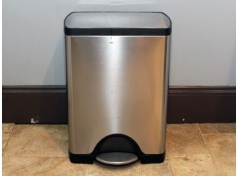 A Stainless Steel Trash Can By Simplehuman